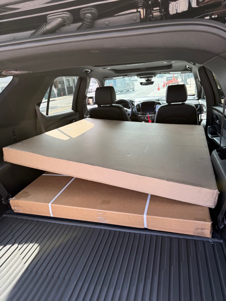 Oversized flat packages protected inside a delivery vehicle