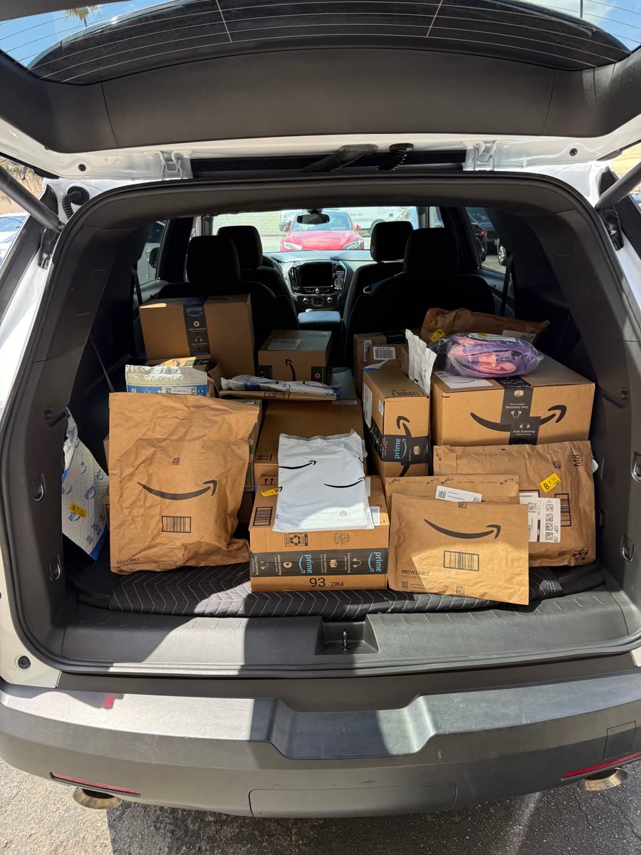 Sorted boxes and envelopes loaded for local delivery